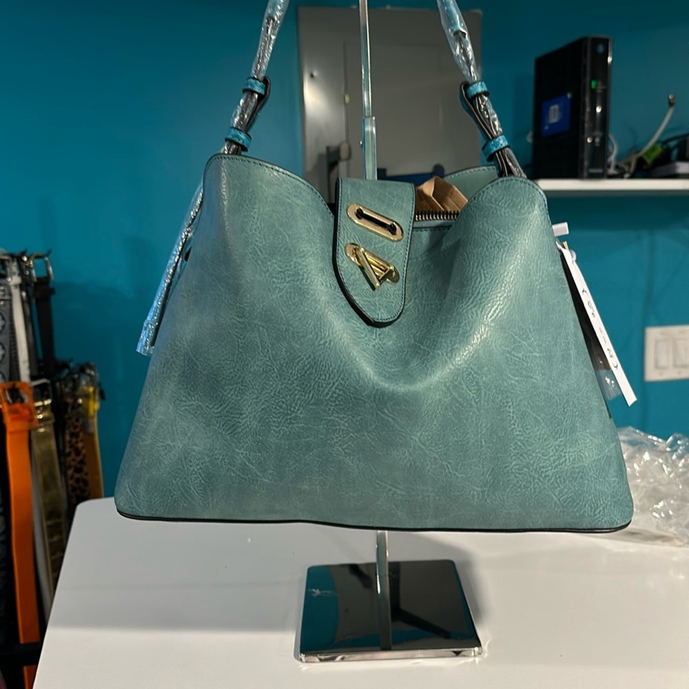 shoulder Handbag turquoise with a little print on the side and the strap